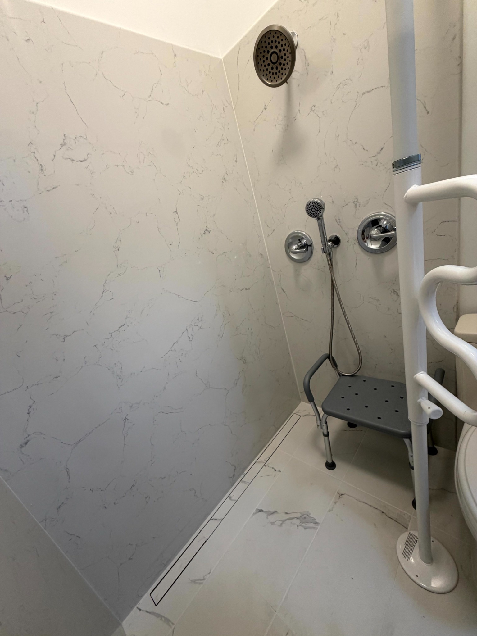 Full accessible curbless shower layout with support equipment